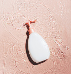 Cosmetic bottle of liquid cream for moisturizing and caring for the body face surface water with...