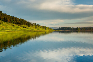 Fototapeta premium Beautiful Landscape with lake and trees. Amazing Nature in Europe. Lovely place to visit this summer.