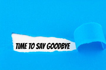 Text Time To Say Goodbye appearing behind ripped blue paper.