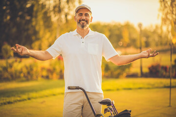Senior golfer standing on court.