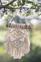 creation of a panel from macrame