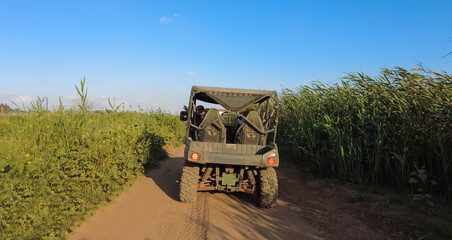 Behind recreational and sport vehicle during trip on sand