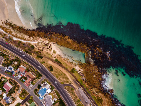 Aerial view of Glencairn tidal pool along the coastline in summertime, Cape Town, South Africa.