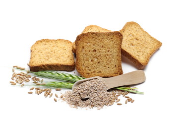 Wholemeal crackers, bread rusks with spelt bran, grains, wooden spoon and young green ears of wheat isolated on white background