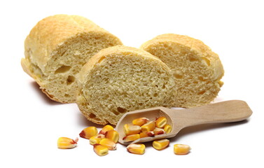 Cornbread slices with corn kernels and wooden spoon isolated on white background