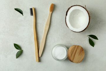 Oral care accessories on white textured background