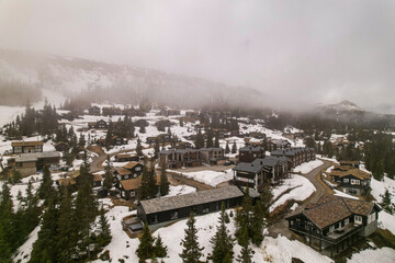 Obraz premium village view with fog and clouds in the mountains norway