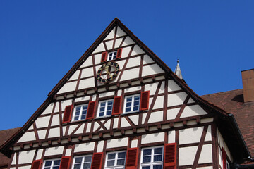 Close-up of the half-timbered town hall building of the city of Münsingen. The house has...