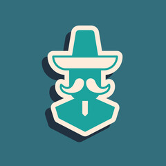 Obraz premium Green Mexican man wearing sombrero icon isolated on green background. Hispanic man with a mustache. Long shadow style. Vector