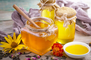 Sweet honey, with kitchen accessories in the composition on the table.