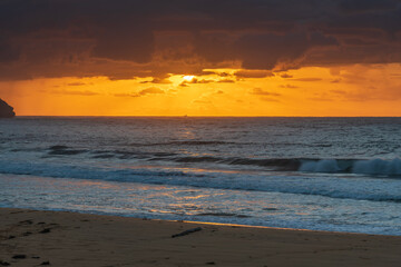 Sunrise seascape with clouds and sun rays