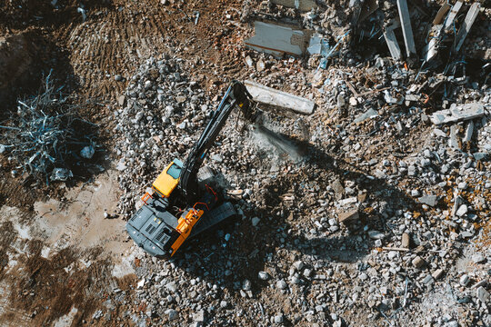 Aerial view of old building demolition work process in construction site in Kaunas city, Lithuania.