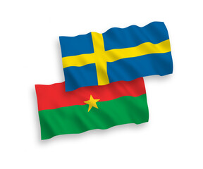 National vector fabric wave flags of Sweden and Burkina Faso isolated on white background. 1 to 2 proportion.