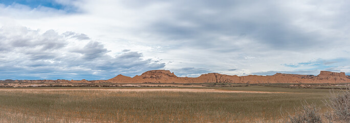 Badlans of Navarre (Bardenas Reales de Navarra) dessert in the middle of Spain. Large size panorama. 2021.