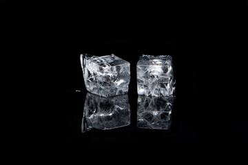 Ice cubes for cocktails on black background