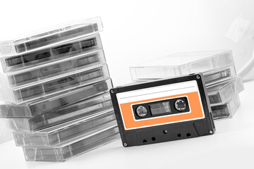 Vintage audio cassette tape. retro audio sound music equipment. Common compact audio cassette, asset data. Selective focus. Dutch angle