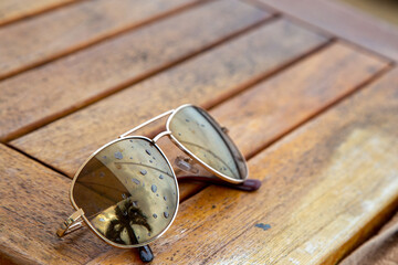 Sunglasses on a wooden table