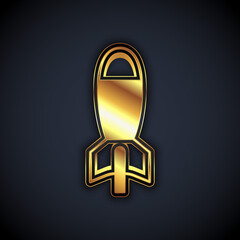 Gold Rocket launcher with missile icon isolated on black background. Vector