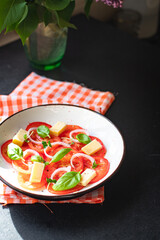 summer tomato salad veggie vegetable, cheese, onion diet vitamin on the table healthy food meal snack copy space food background rustic. top view vegan or vegetarian food