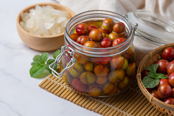 Pickled Plums on the white background.