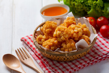 shrimp balls covered with breaded fried on the white wooden background.