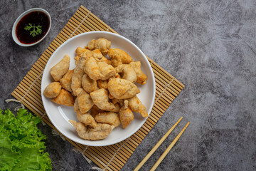Deep fried fish ball on the dark background.