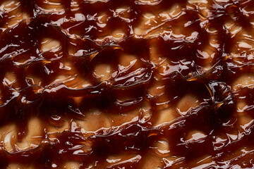 Chocolate colored gel smear and texture. Cosmetic gel or caramel syrup on white background