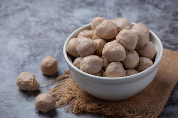 Beef ball fried on the dark wooden background.