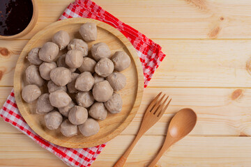 Beef ball fried on the wooden background.