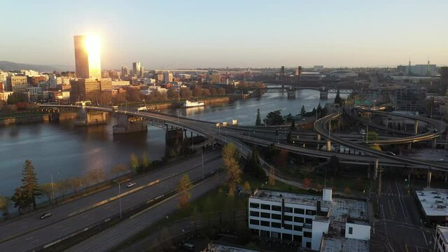 Cinematic aerial drone shot of Portland Pearl and Lloyd Districts, East Portland, Buckman Neighborhood, waterfront, Willamette River, Tom McCall Waterfront Park, skyscrapers and cityscape in Oregon
