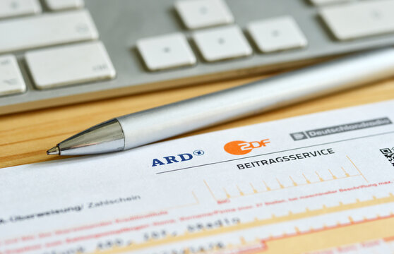 Form and letter of the german radio and tv broadcast service (GEZ, ARD and ZDF Beitragsservice) on a desk