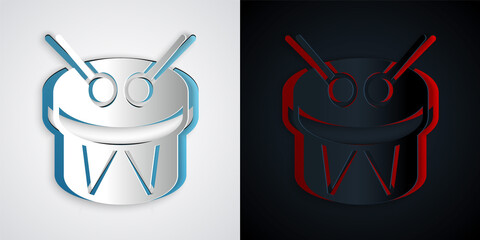 Paper cut Musical instrument drum and drum sticks icon isolated on grey and black background. Paper art style. Vector