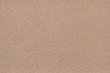 Fototapeta na wymiar Textured brown vintage paper background. Horizontal background for design, closeup
