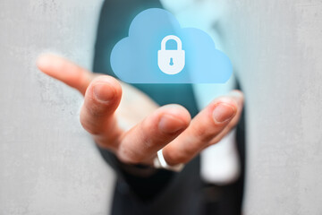 business man holding virtual secured cloud. Secured business cloud computing