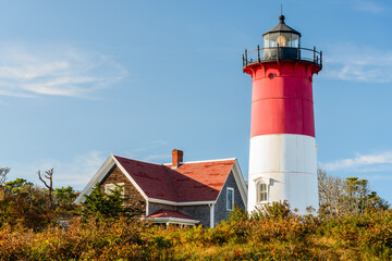 Fototapeta na wymiar View of Beautiful Nauset Lighthouse at sunset in autumn. Cape Cod, MA, USA.