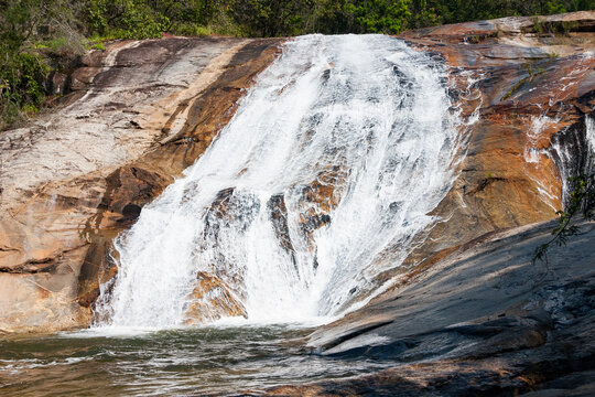 Small waterfall over colored rocks near Debegeni Falls, Limpopo, South Africa