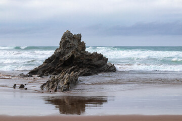Fototapeta na wymiar rock formation on the beach of sopelana, in the province of vizcaya