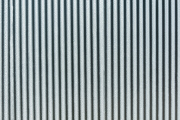 Gray metallic vertical material stylized wall.