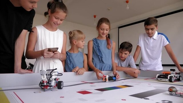 Robotics competitions. A group of children assembled robots from plastic parts.