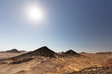 Sunny Black Desert with the clear blue sky on the background.