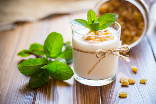 Sweet Homemade Yogurt With Raisins In A Glass