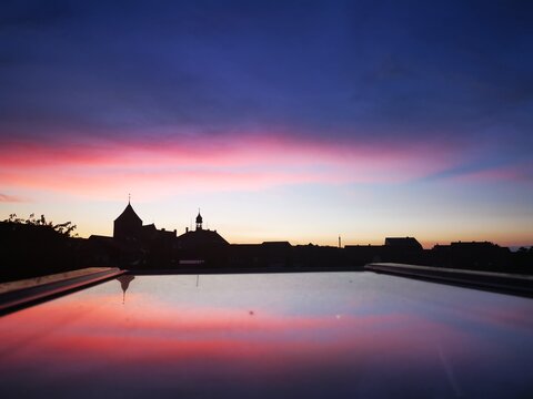 sunset over Teterow in Germany, reflections in window