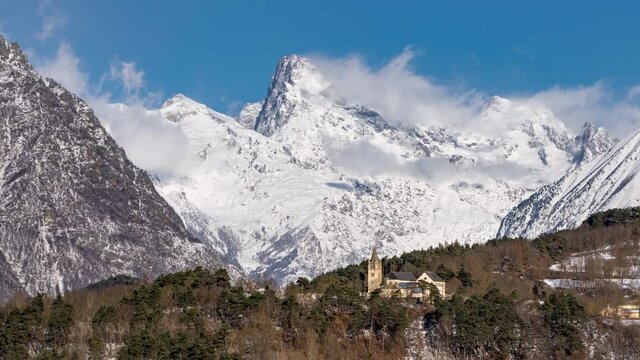 The Olan peak in the Ecrins National Park with the church of the village of Chauffayer (time-lapse). Major peak of the GR54 Ecrins Massif hiking tour. Valgaudemar, Hautes-Alpes, French Alps, France