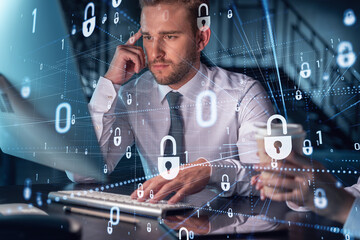 Two colleagues working together to protect clients confidential information and cyber security. IT...
