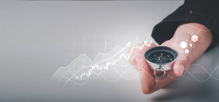 Business Navigate Concept, Businessman Holding Compass Navigation For Guide To Recovery Business Planning Growth In The Economic Crisis And Trading Graph Financial Data, Action Plan Icon.