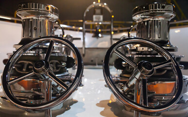 The bow of the yacht with anchor stops, part of the anchor chain and winches for tightening the...