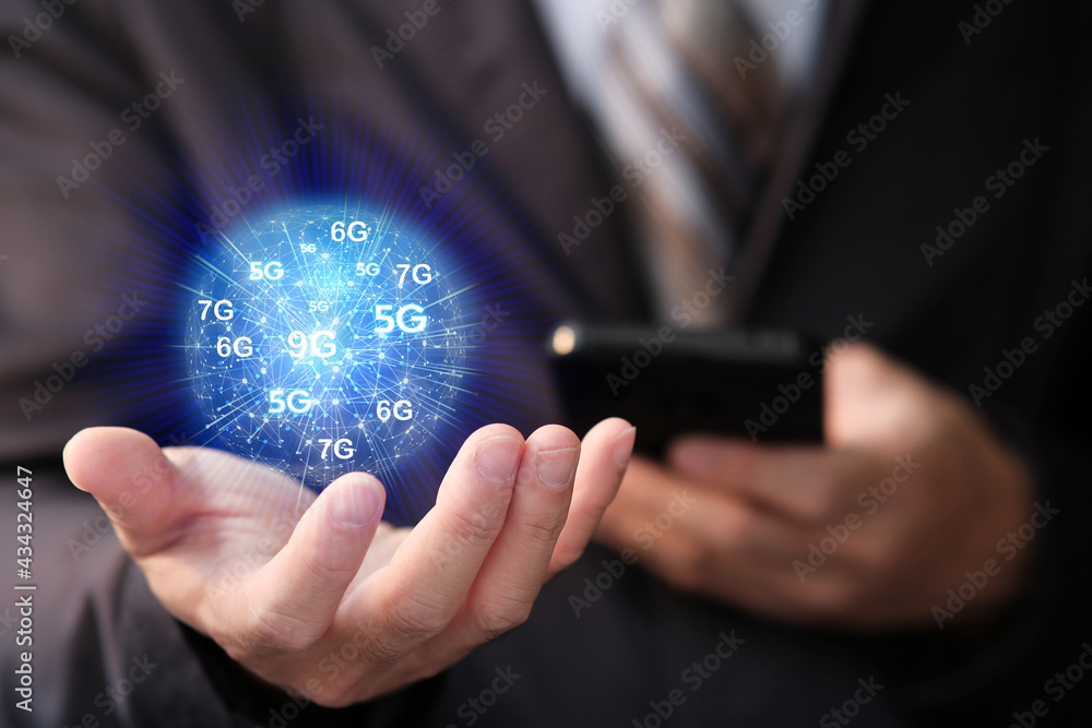 Aufkleber businessman using a smartphone with internet and wifi network technology in future