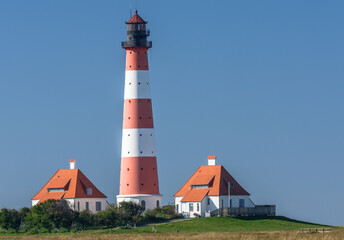 Fototapeta na wymiar Leuchtturm Westerheversand, Westerhever, Eiderstedt, Nordfriesland, Schleswig-Holstein, Deutschland