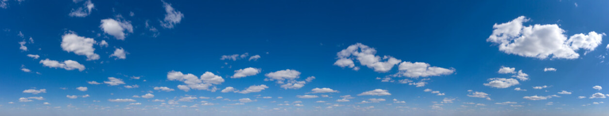 Blue Sky background with tiny Clouds. Panorama background