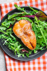 salmon and salad leaves green fish seafood snack pescetarian diet meal copy space food background rustic. top view 